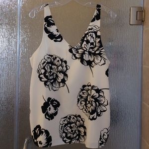 Sleeveless blouse with black floral designs